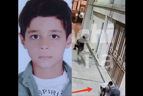 طفل شجاع يساعد أبيه الجريح خلال الهجوم الارهابي على مرقد 